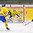 LUCERNE, SWITZERLAND - APRIL 16: Sweden's Felix Sandstrom #29 attempts to make the save against Slovakia's Peter Valent #21 while Gabriel Carlsson #25 looks on during preliminary round action at the 2015 IIHF Ice Hockey U18 World Championship. (Photo by Matt Zambonin/HHOF-IIHF Images)

